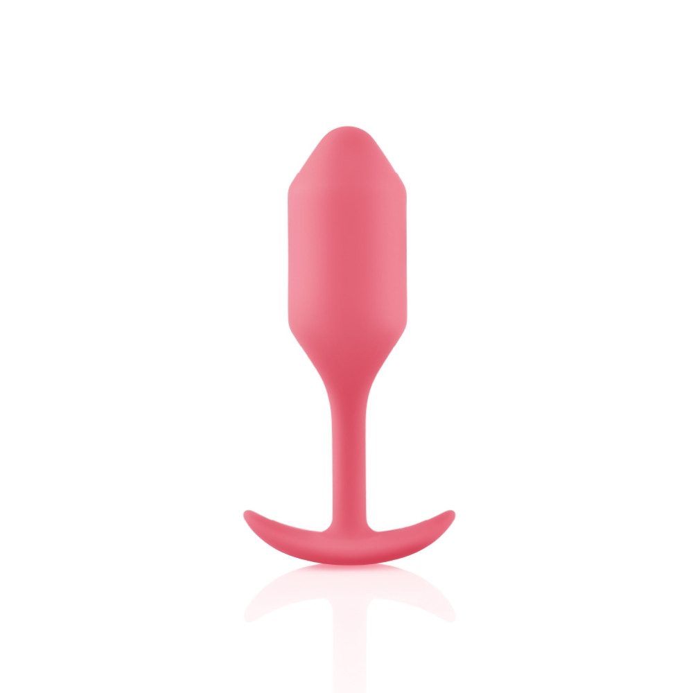 Анальная пробка со смещенным центром тяжести B-Vibe Snug Plug 2, силиконовая, коралловая, 10.5 х 3 см фото №0 — секс игрушки: Украина, NO TABOO