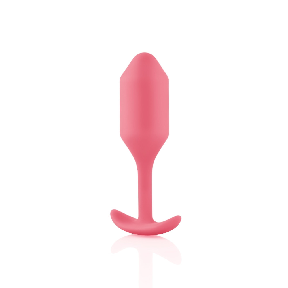 Анальная пробка со смещенным центром тяжести B-Vibe Snug Plug 2, силиконовая, коралловая, 10.5 х 3 см фото №3 — секс игрушки: Украина, NO TABOO