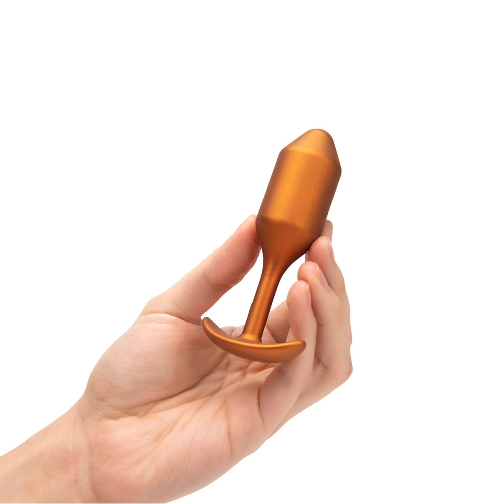 Анальная пробка с утяжелением размер M, B-Vibe Snug Plug 2, оранжевая, 10.5 х 3 см фото №8 — секс игрушки: Украина, NO TABOO